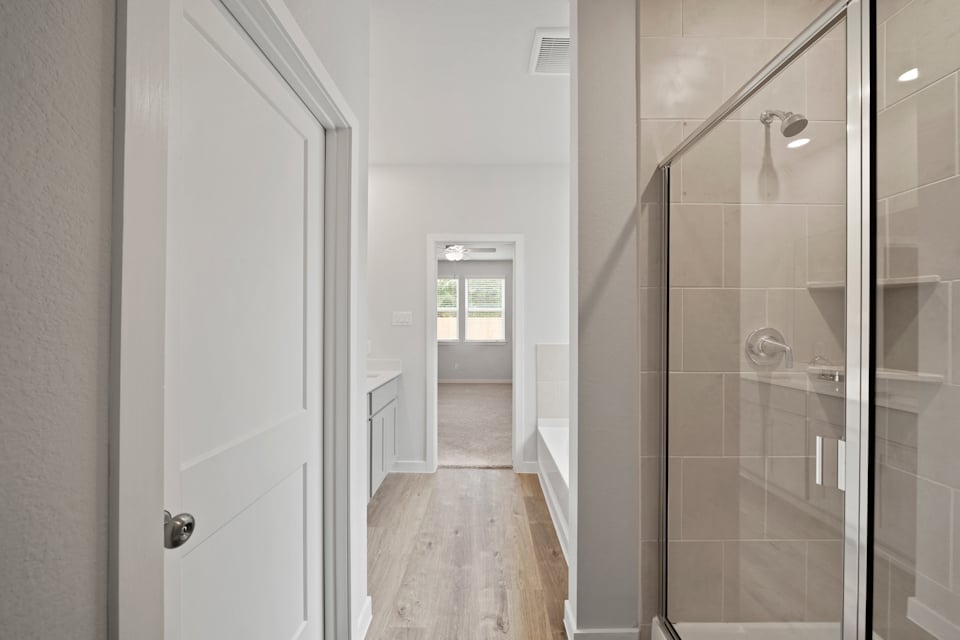 A shower with a glass door.