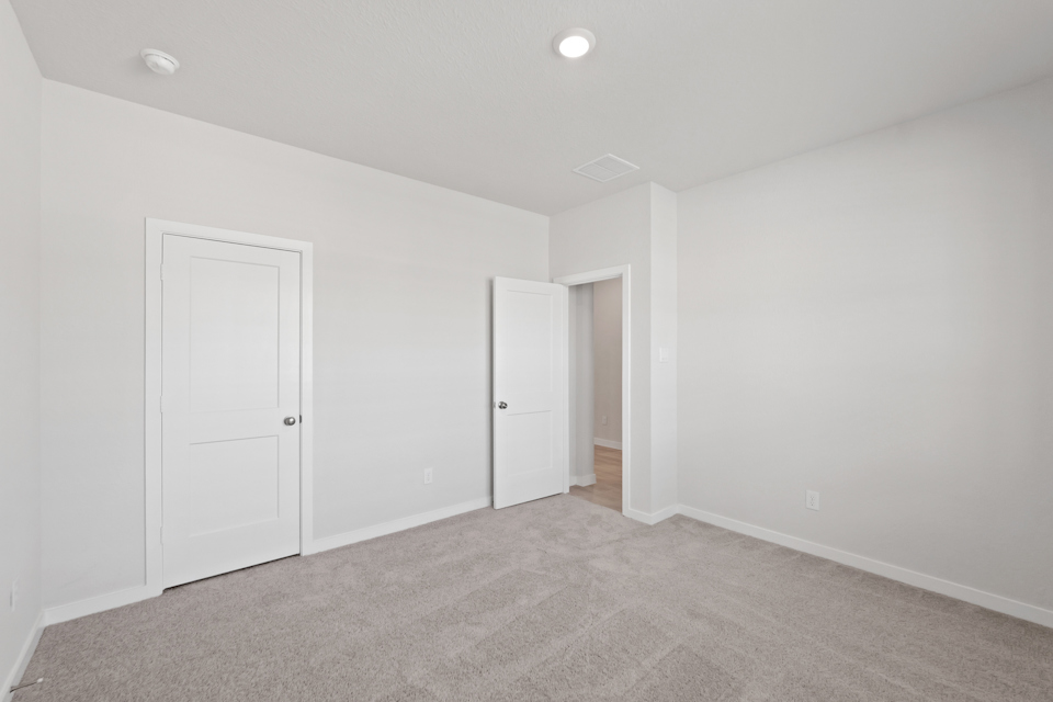 A room with white doors.