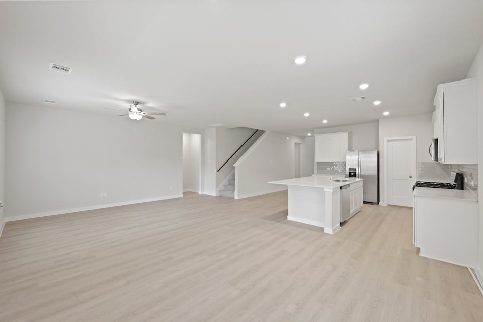 A large kitchen with white cabinets.