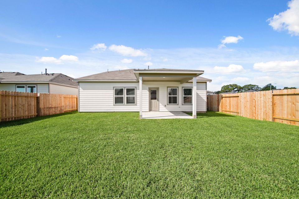 A house with a fence around it.