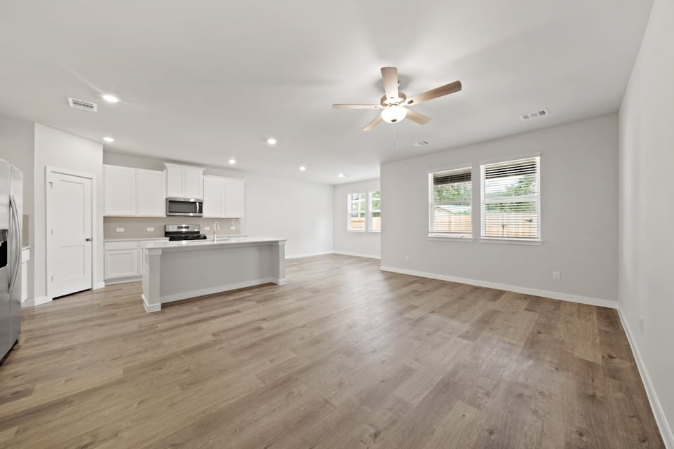 A large kitchen with white cabinets.