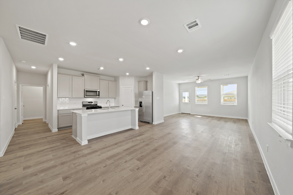 A large kitchen with white cabinets.