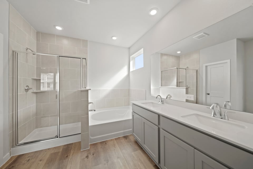 A bathroom with a glass shower.