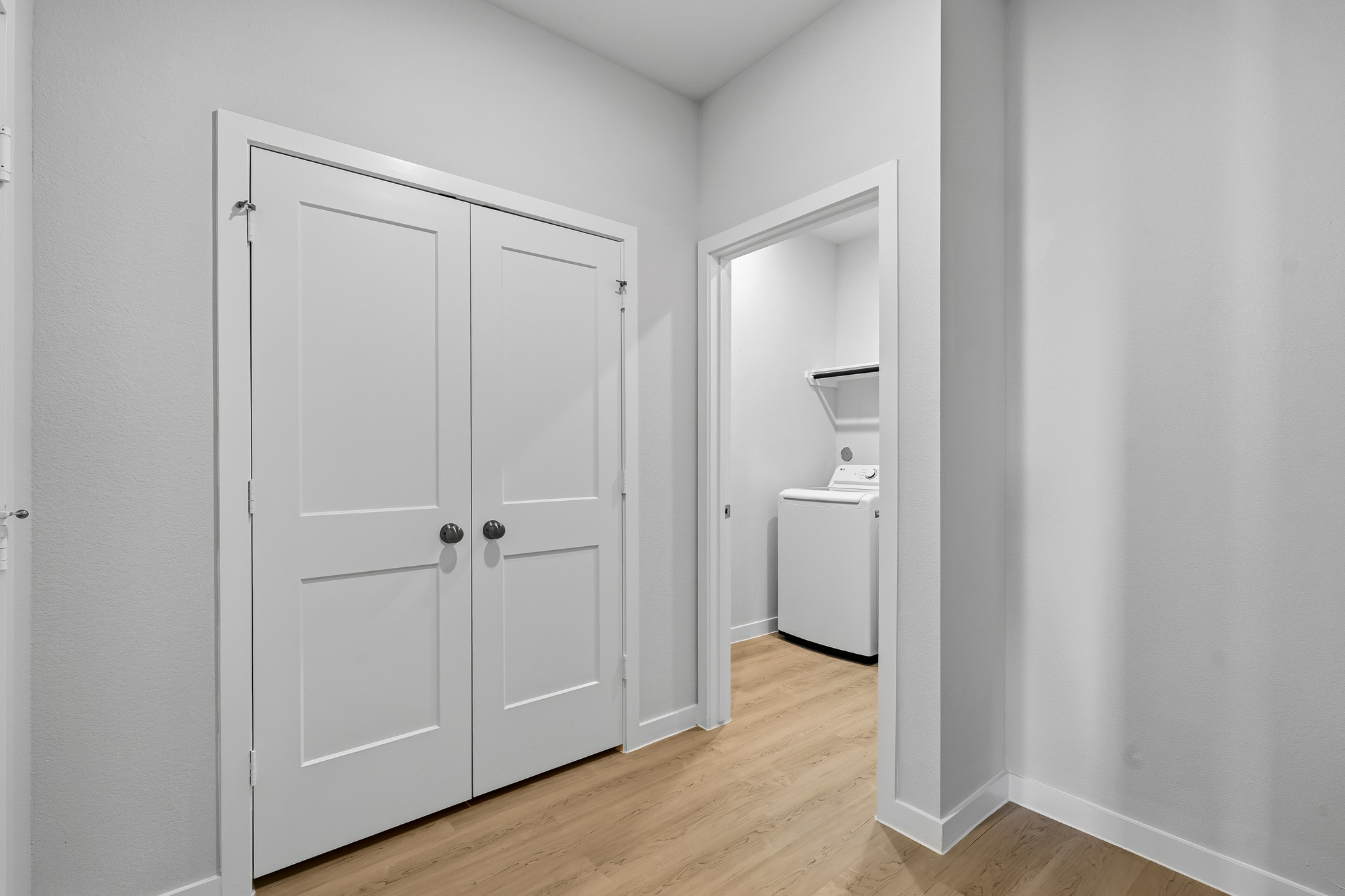 A room with white cabinets.