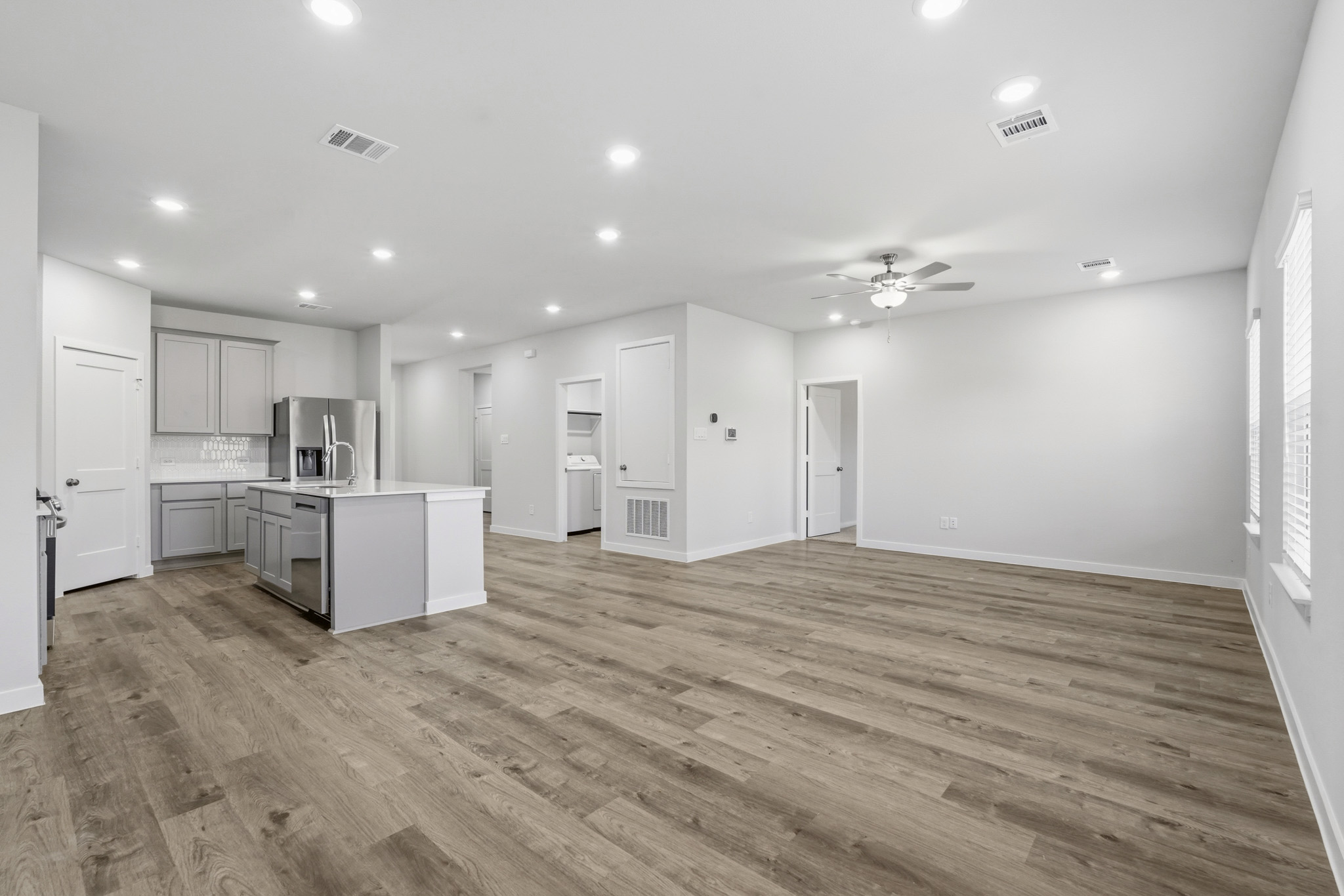 A large kitchen with white cabinets.