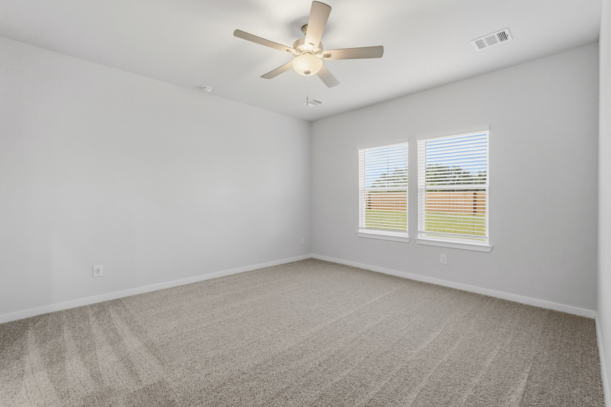 A ceiling fan in a room.