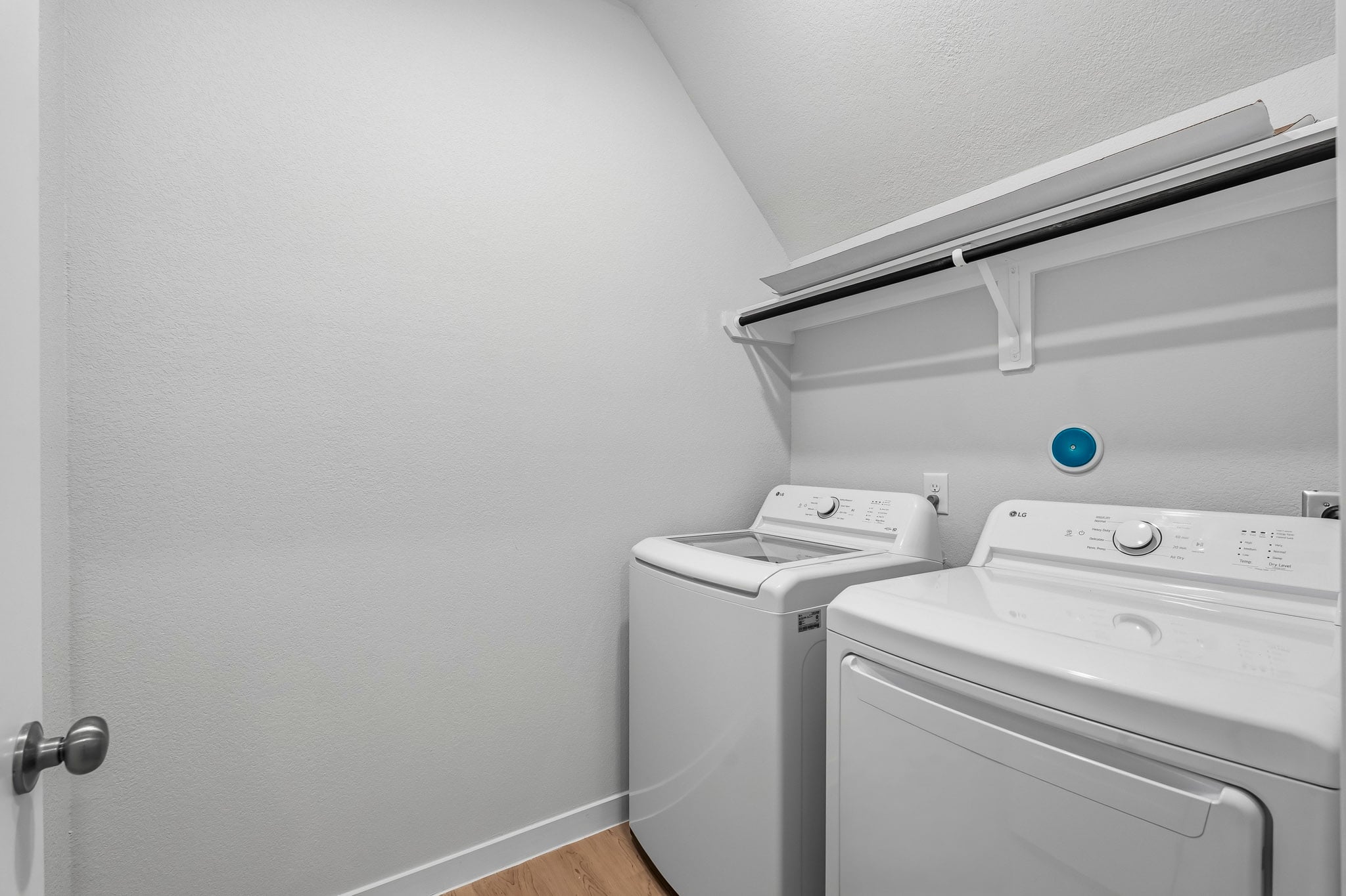 A washing machine in a room.
