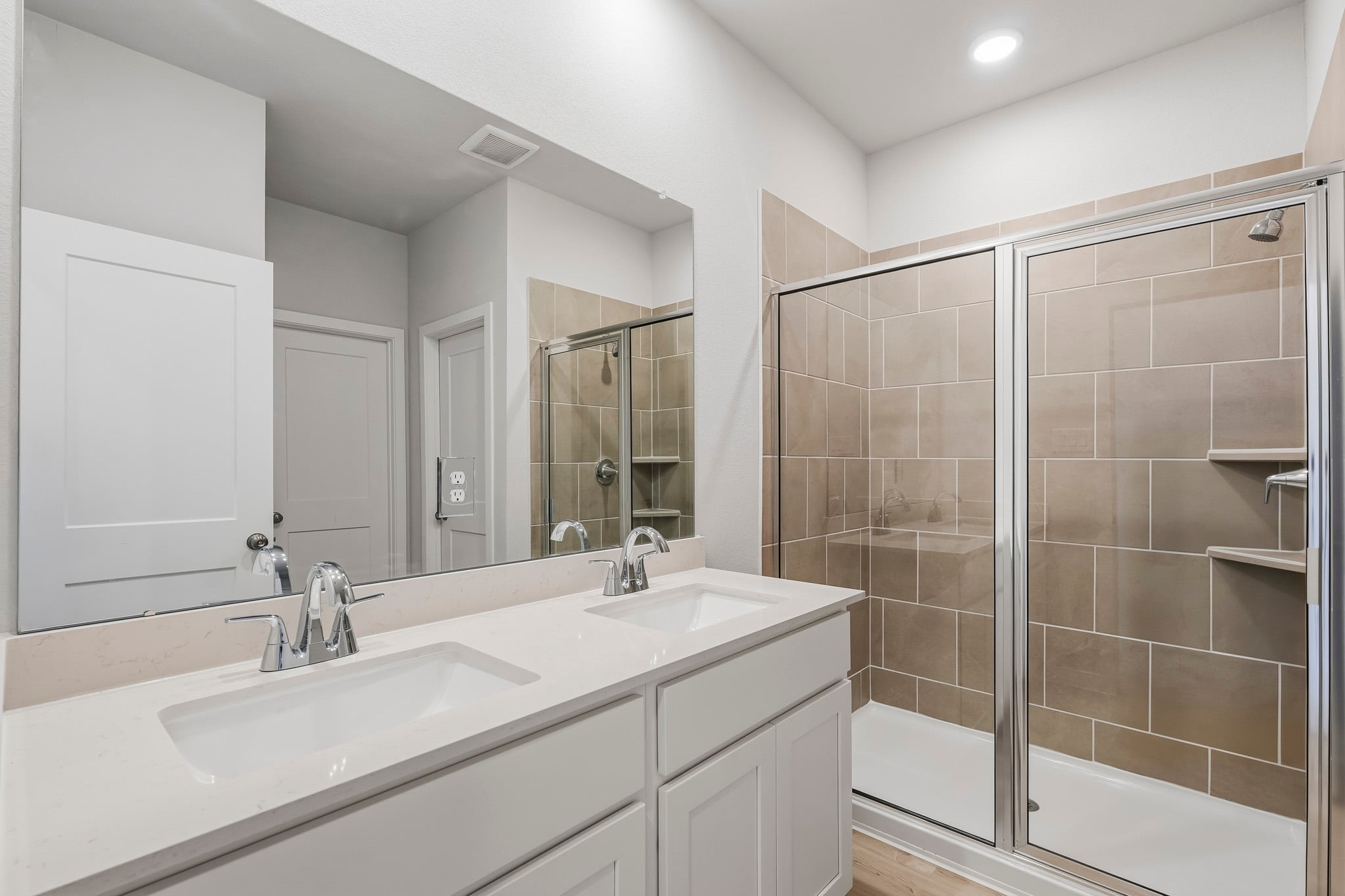 A bathroom with a glass shower.