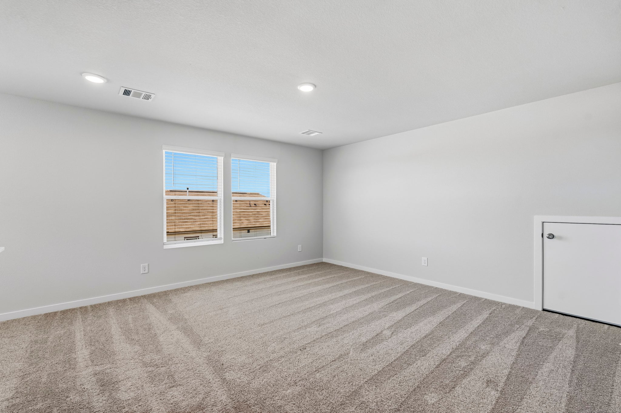 A room with a window and a door.