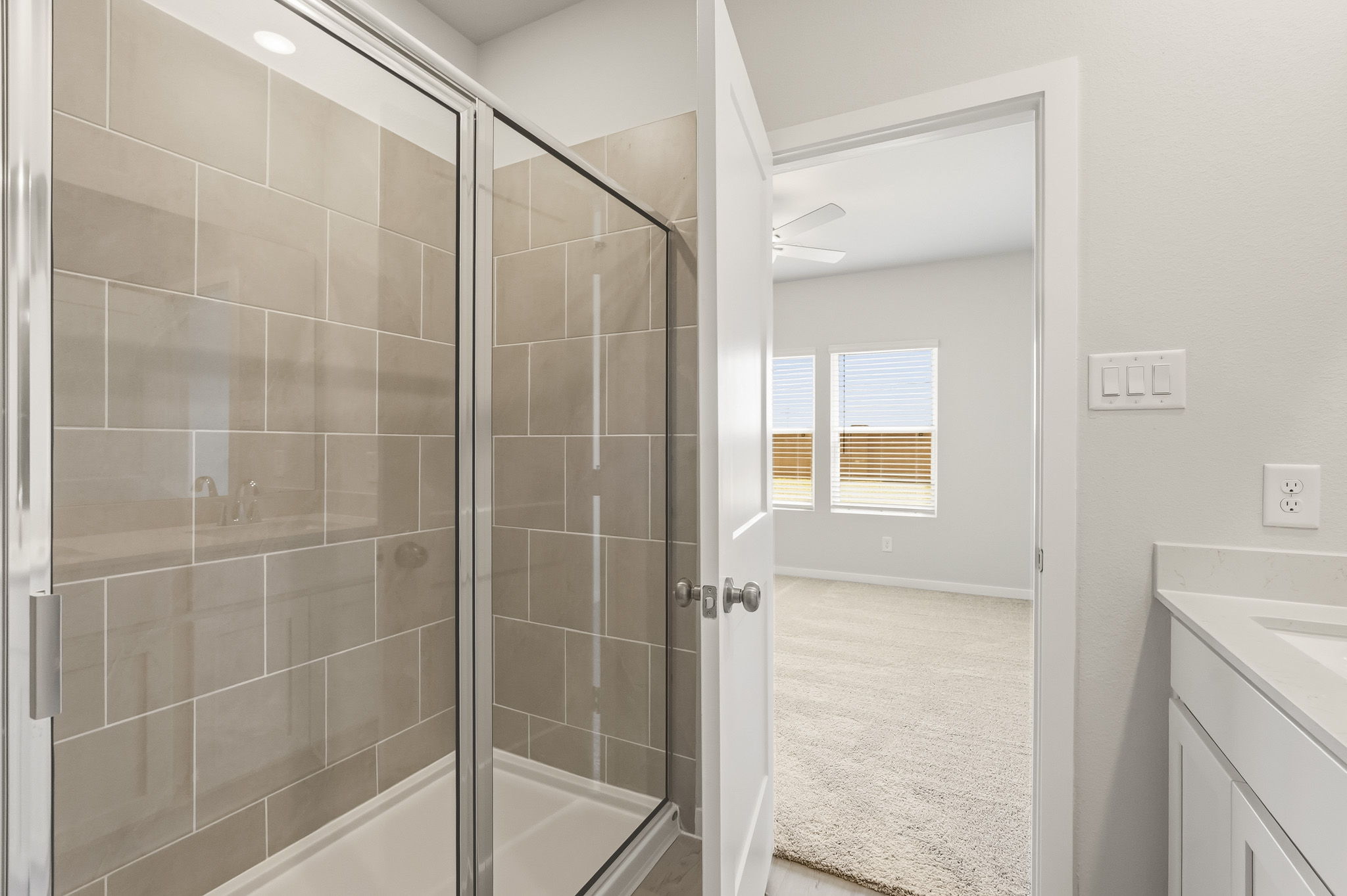A bathroom with a glass shower.