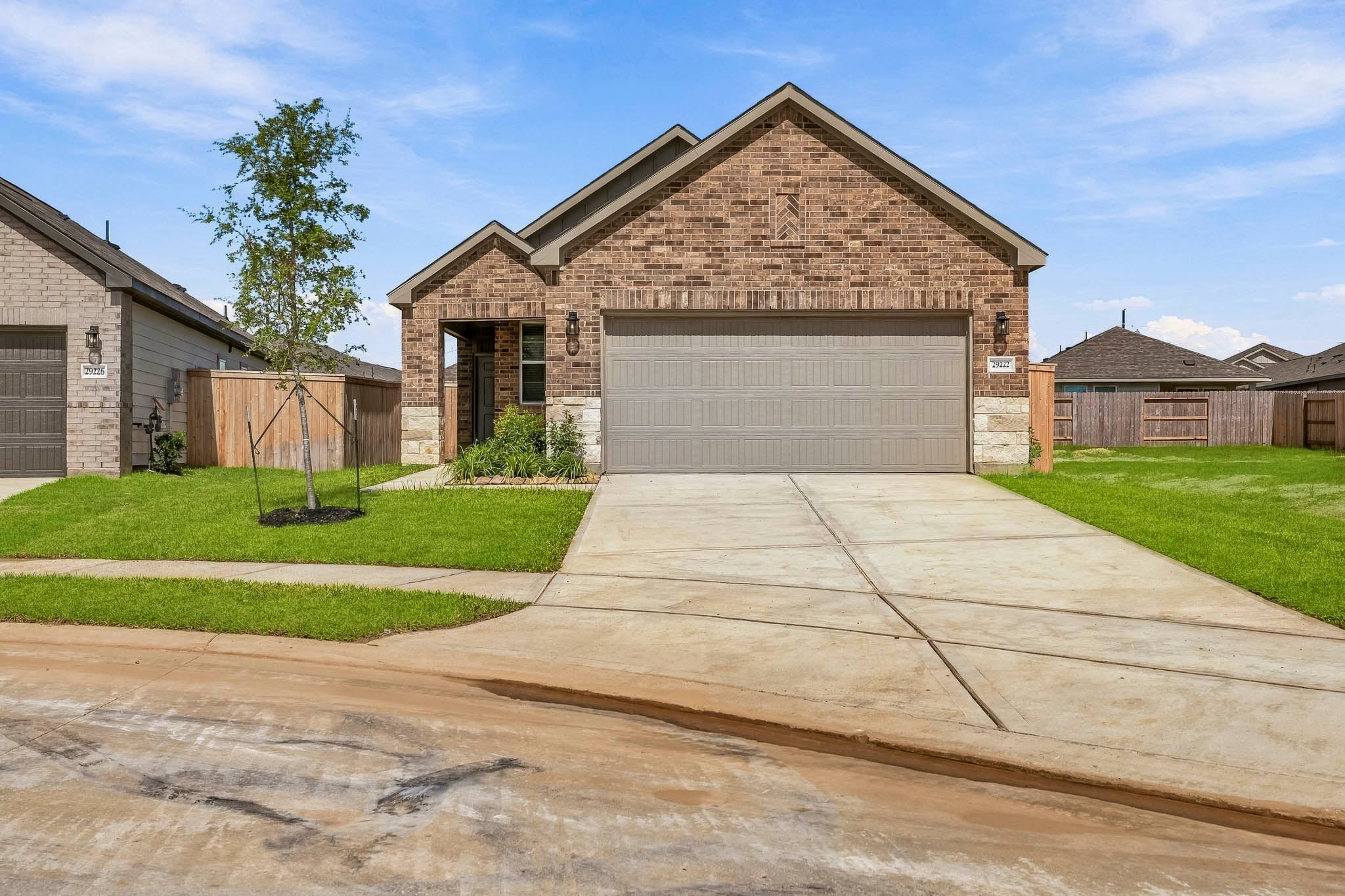 A driveway leading to a house.