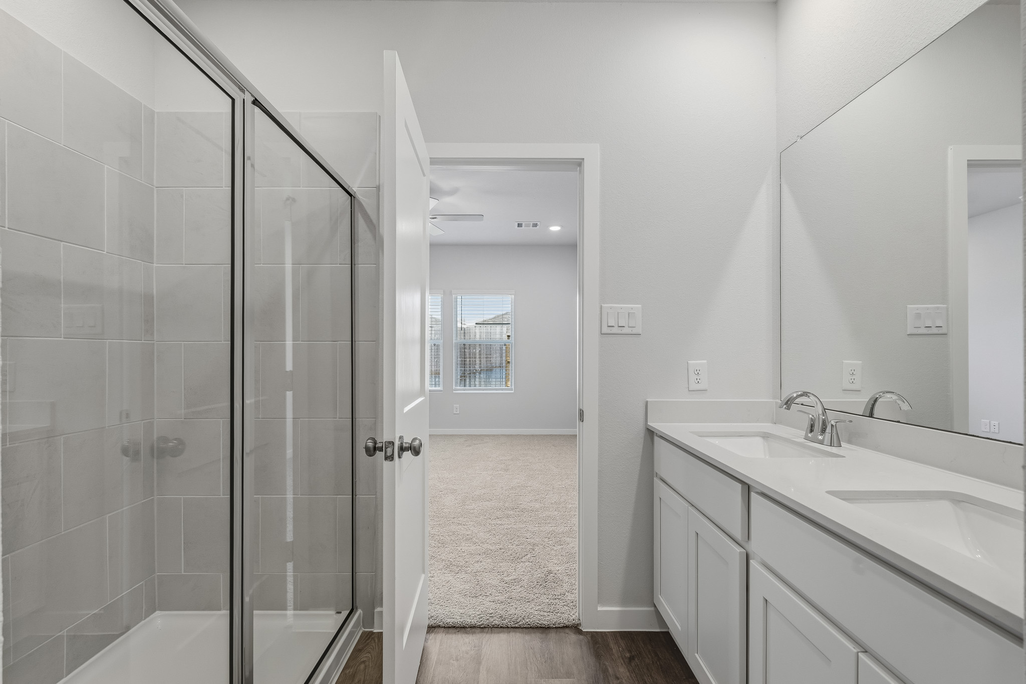 A bathroom with a glass shower.