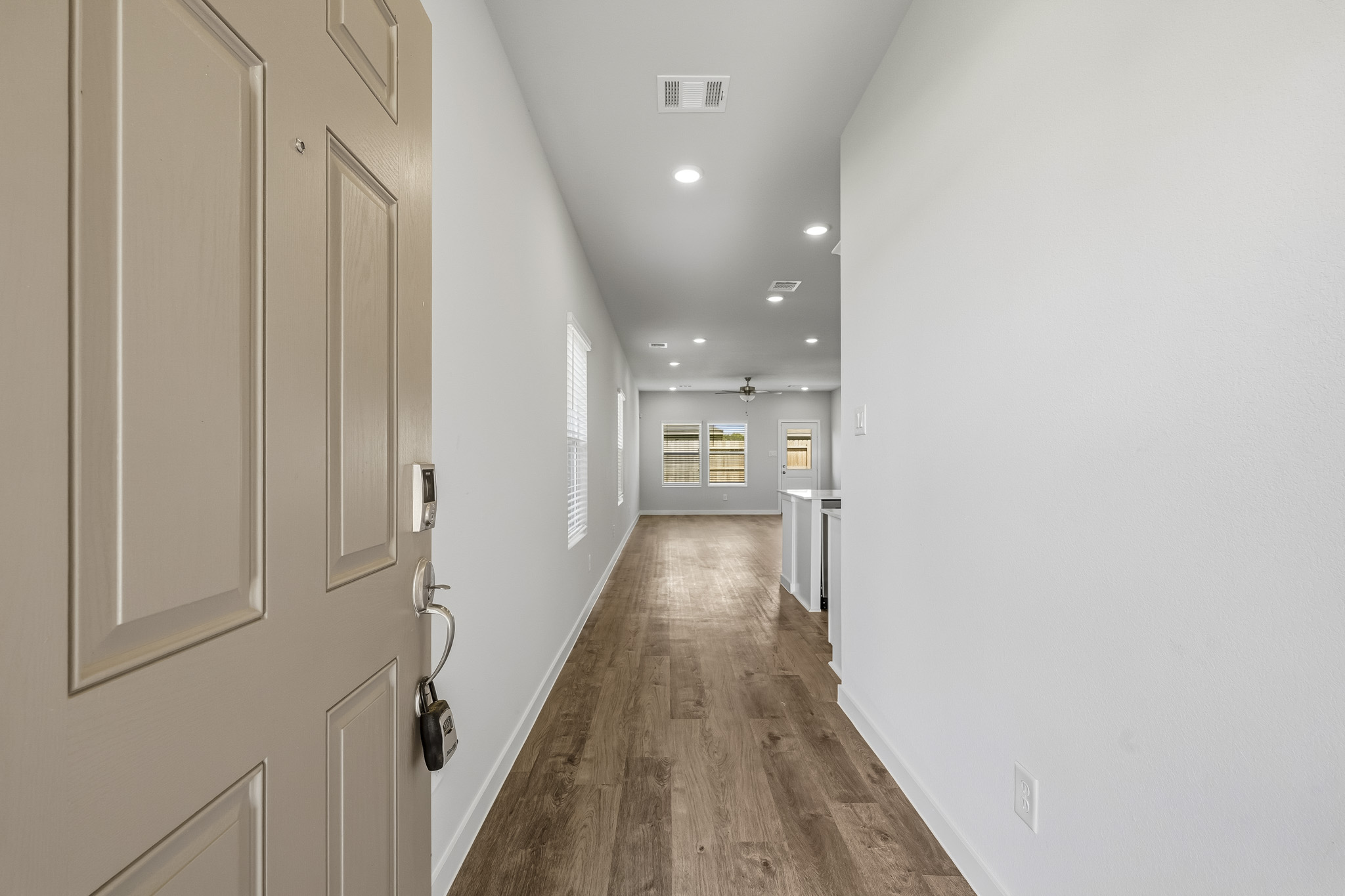 A hallway with white walls.