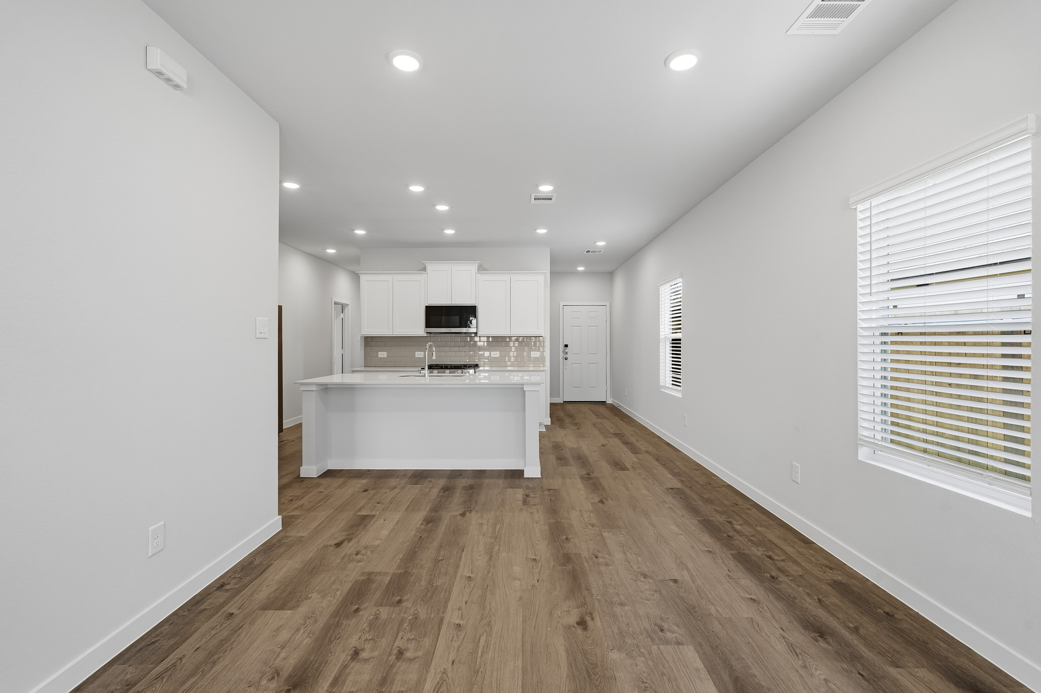 A kitchen with white walls.