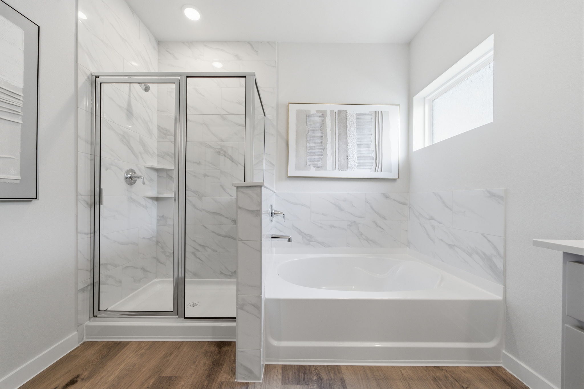 A bathroom with a glass shower.