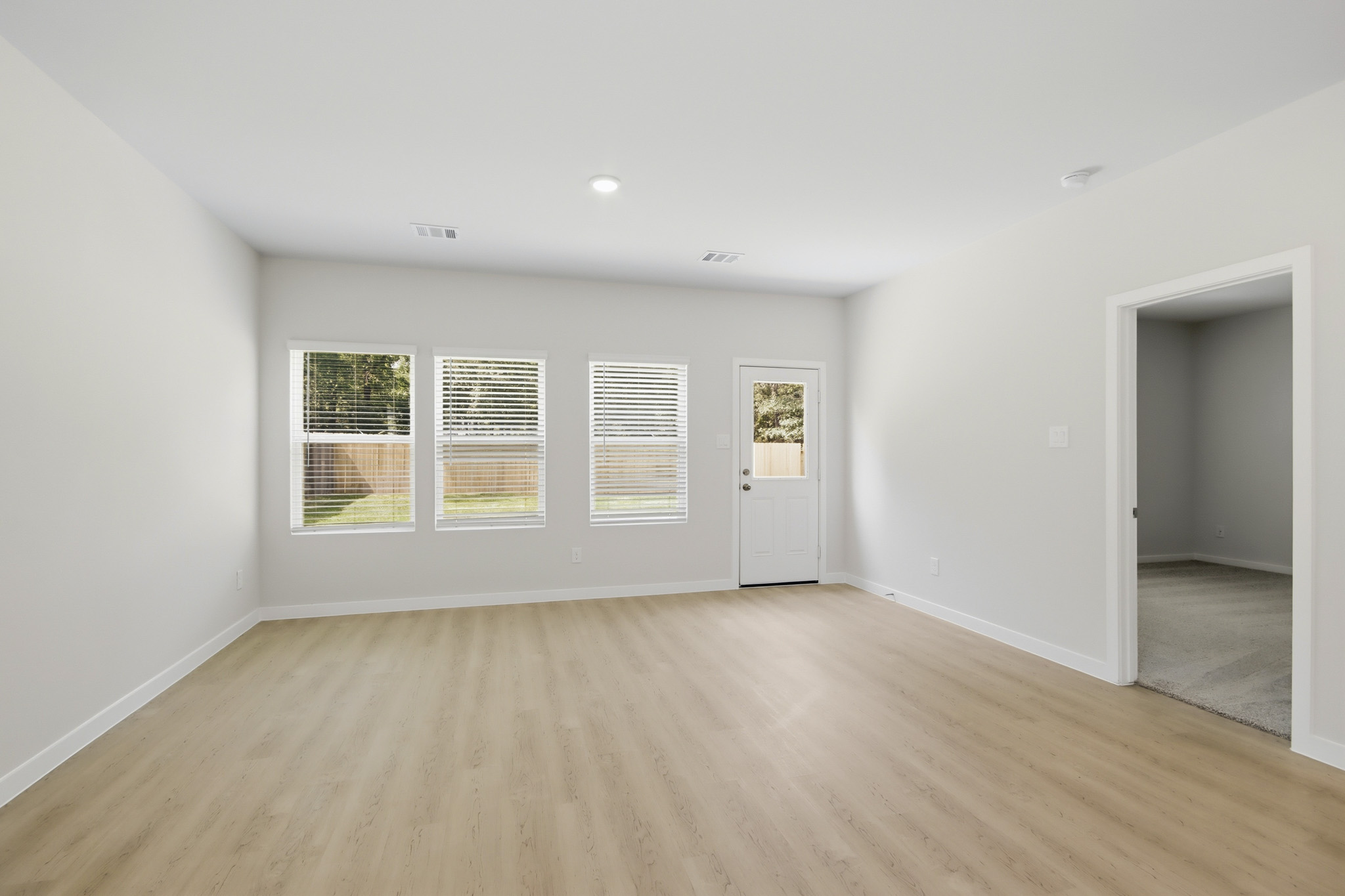 A room with a wood floor and a wood floor.