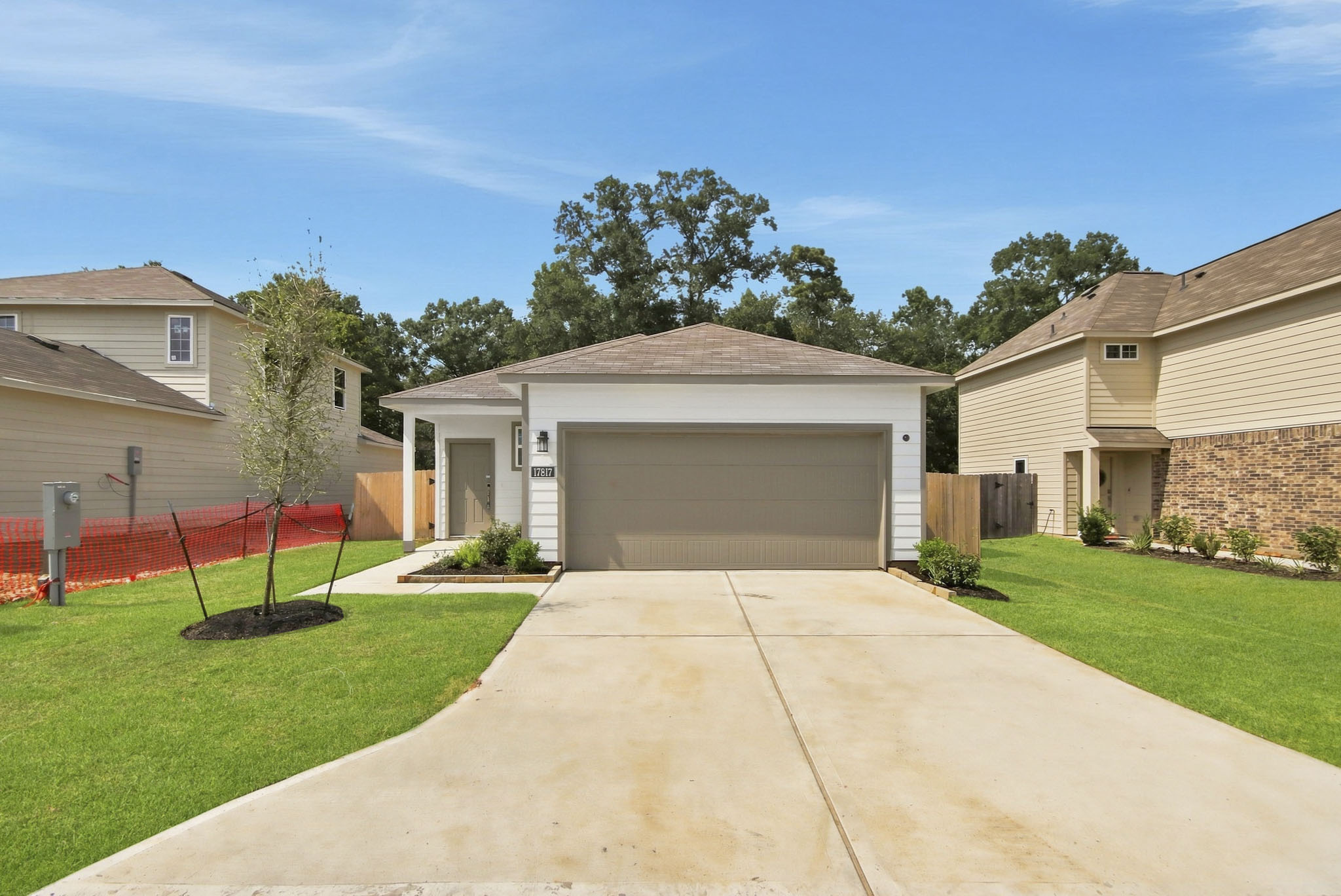 A driveway leading to a house.