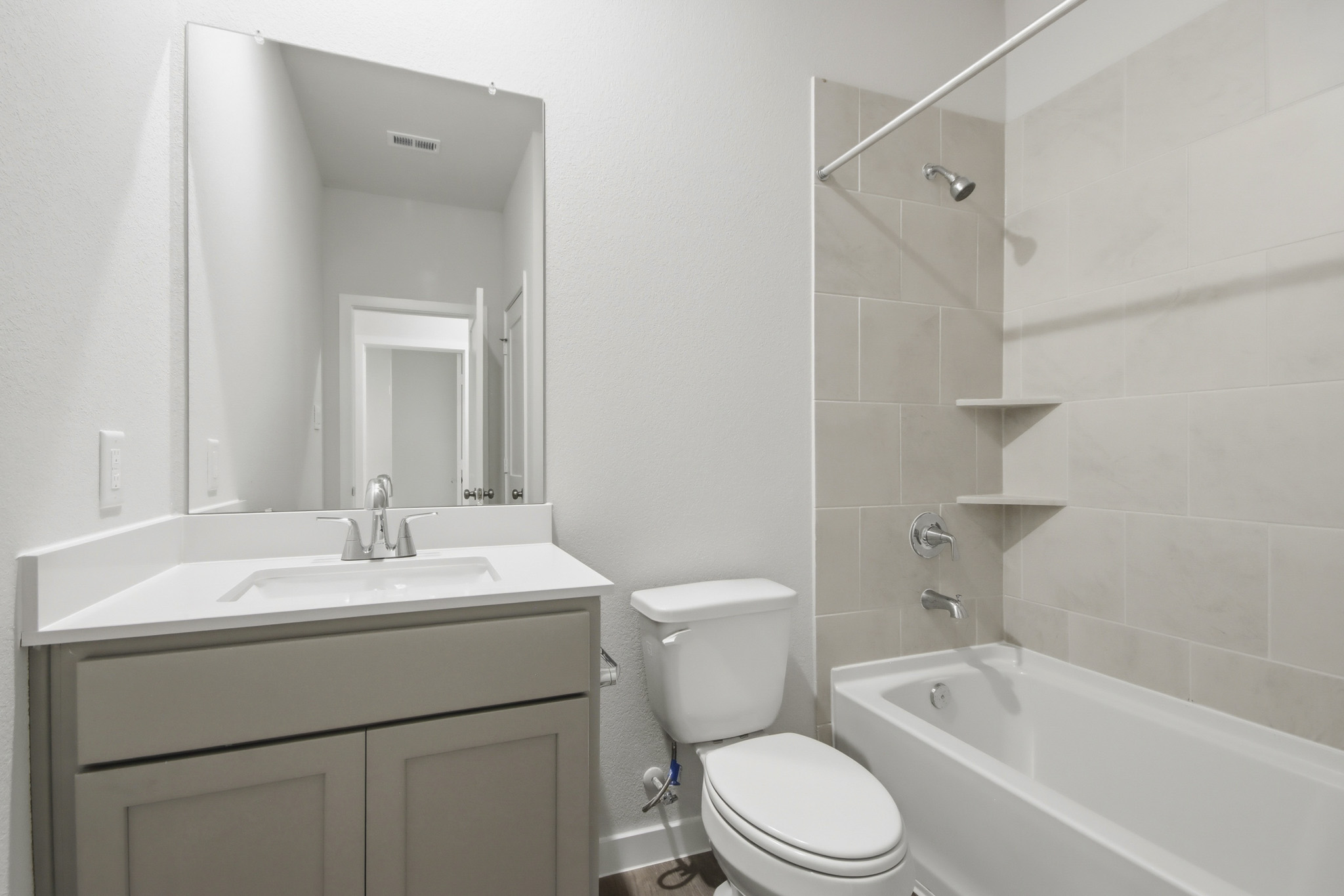A bathroom with a standup shower.