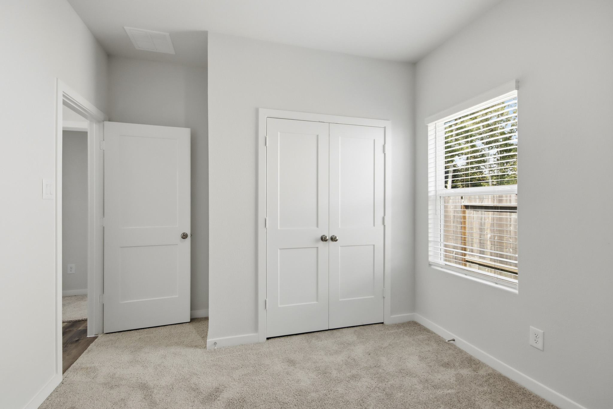 A room with white doors.