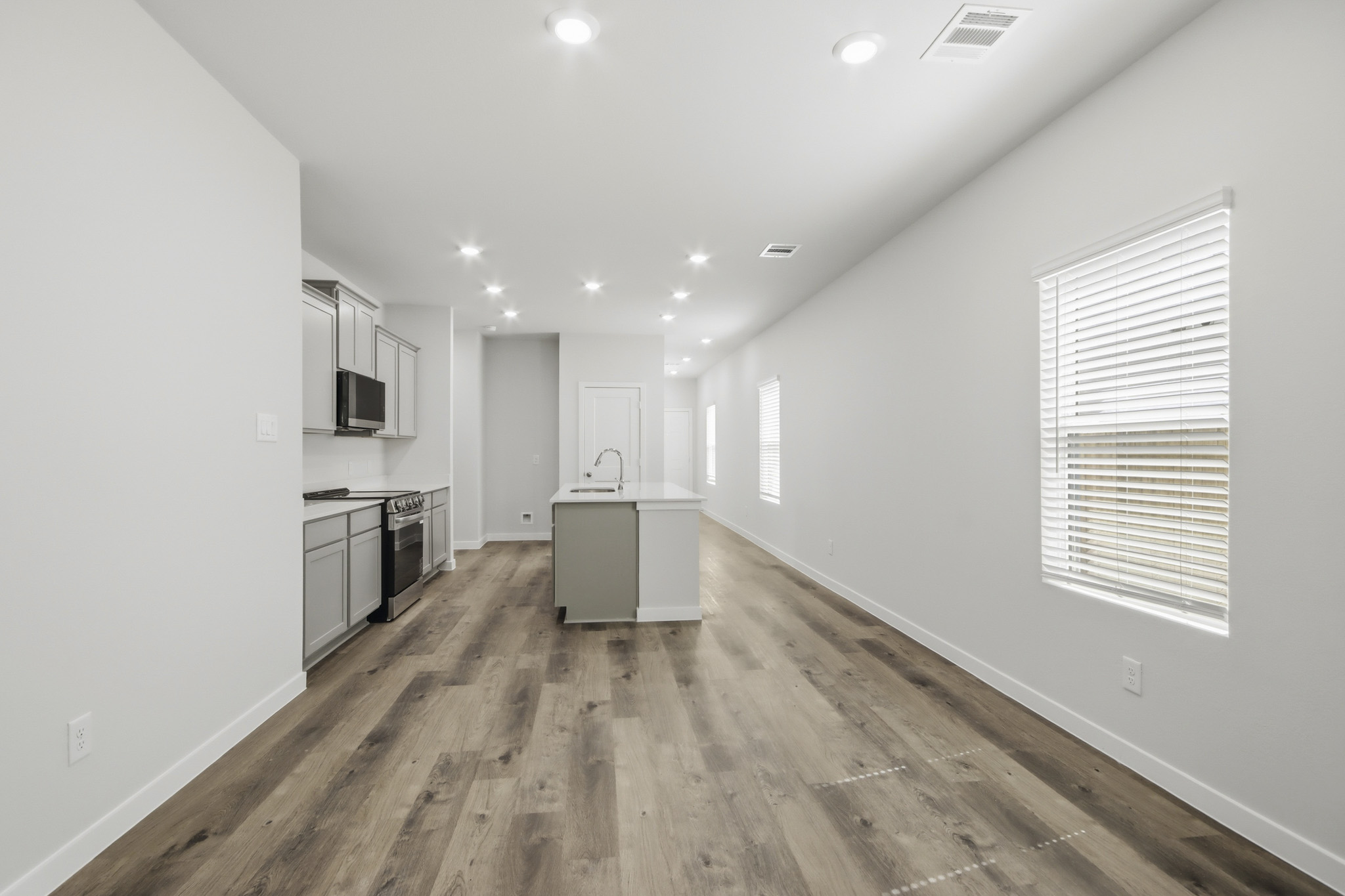 A kitchen with white walls.
