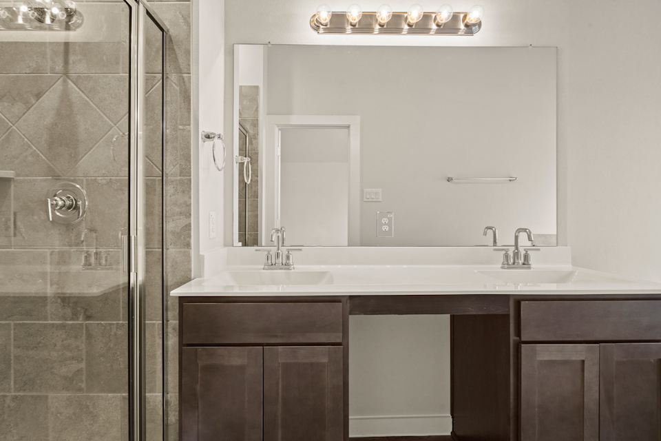 A bathroom with a glass shower.