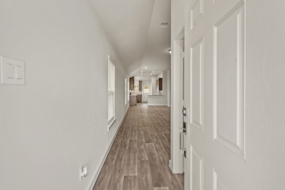 A hallway with white doors.