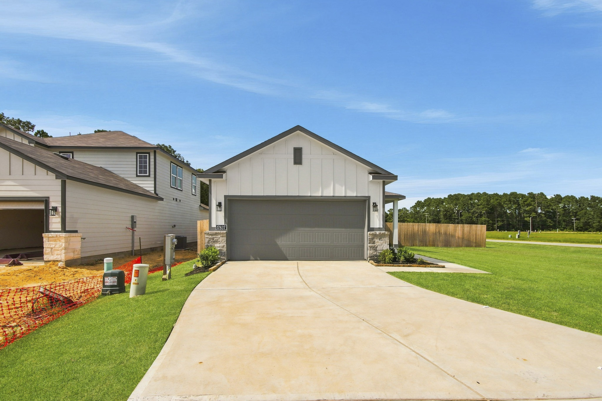 A driveway leading to a house.