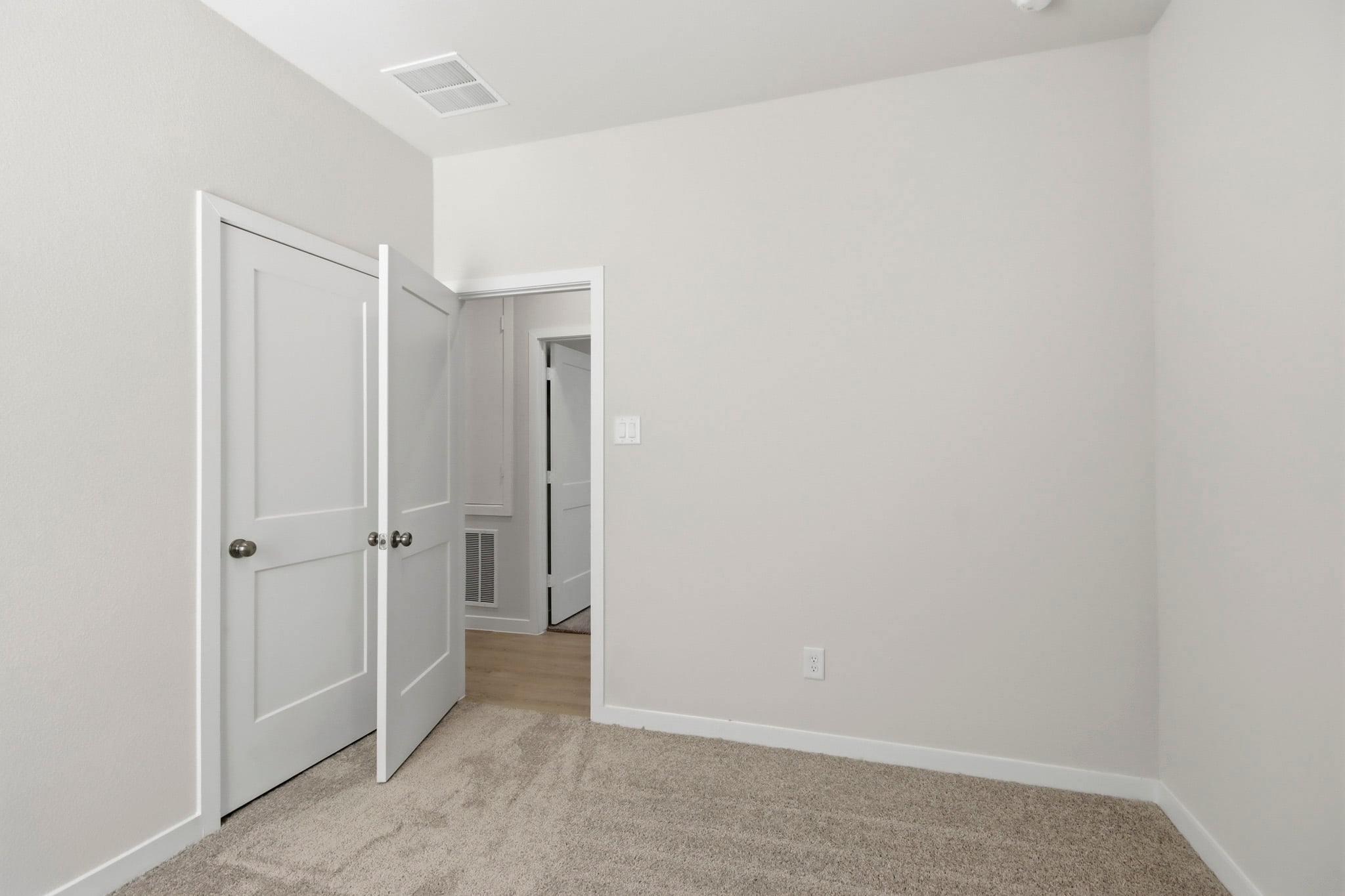 A room with white doors.