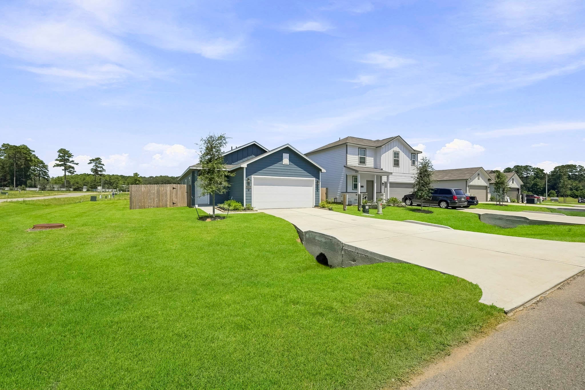 A neighborhood with a large lawn.