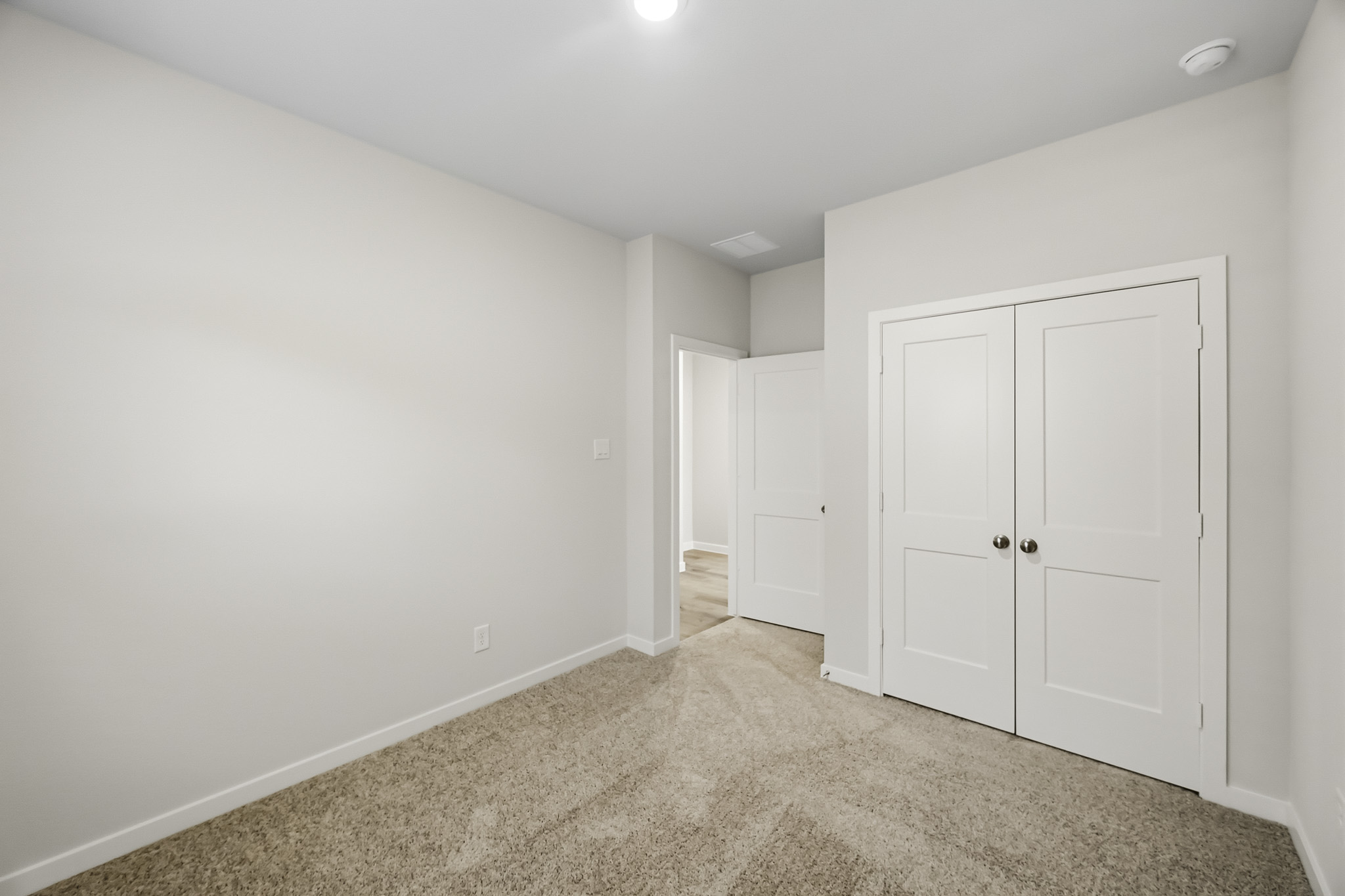 A room with white doors.