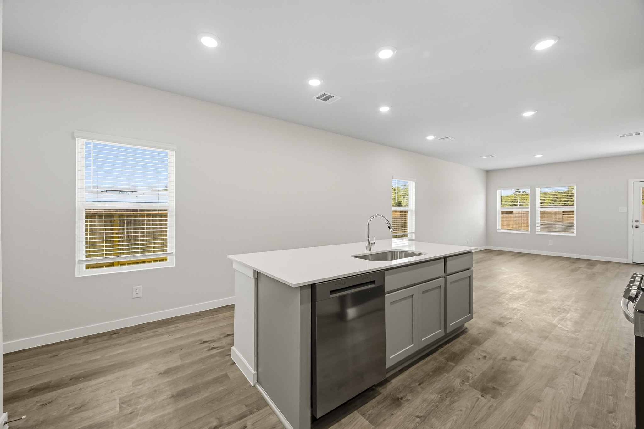 A kitchen with a sink and cabinets.