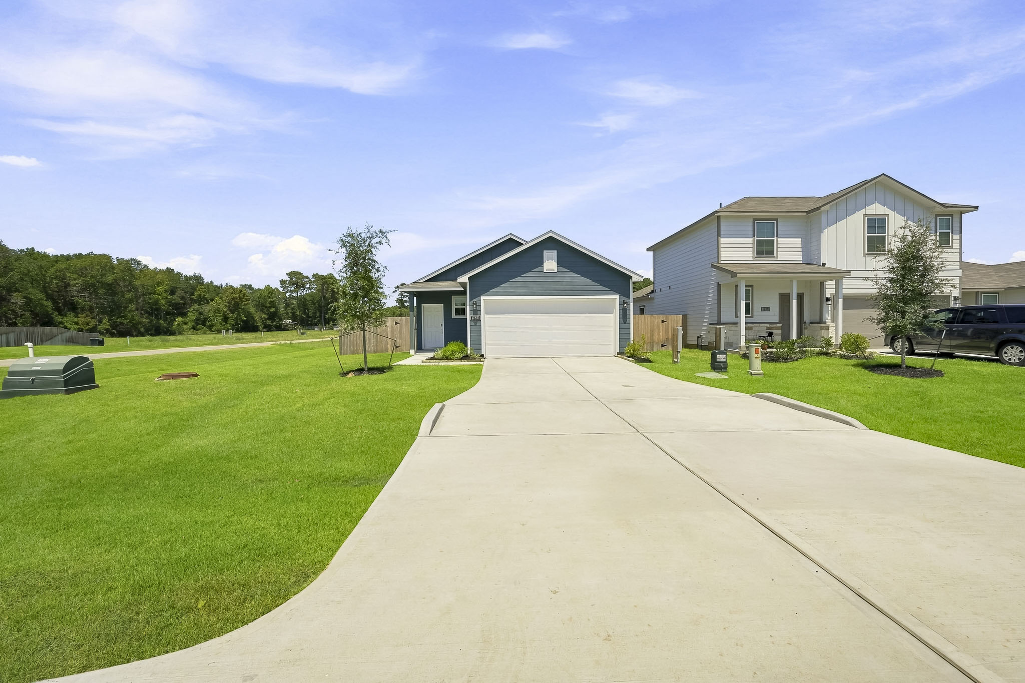 A driveway leading to a house.
