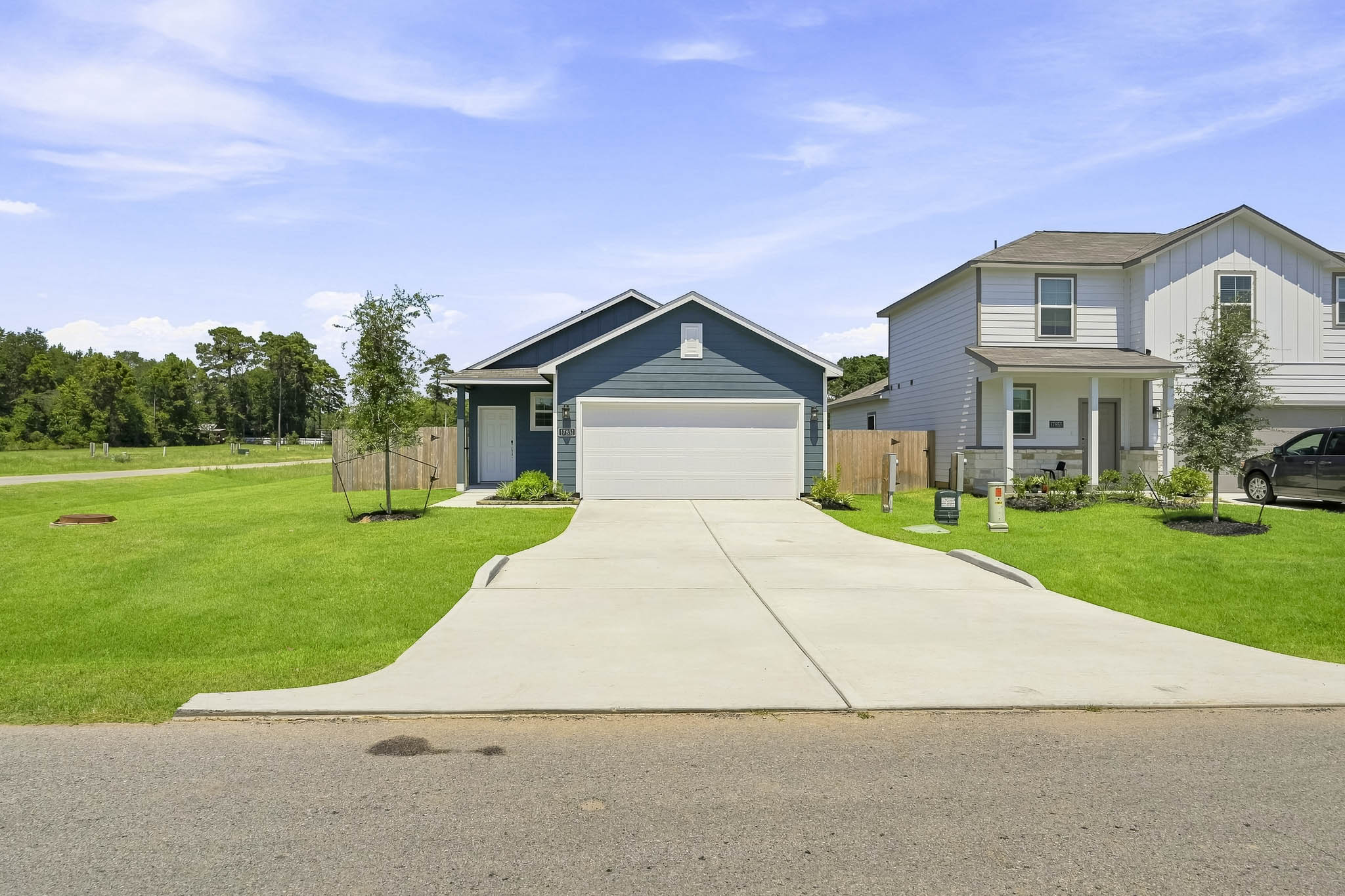 A driveway leading to a house.