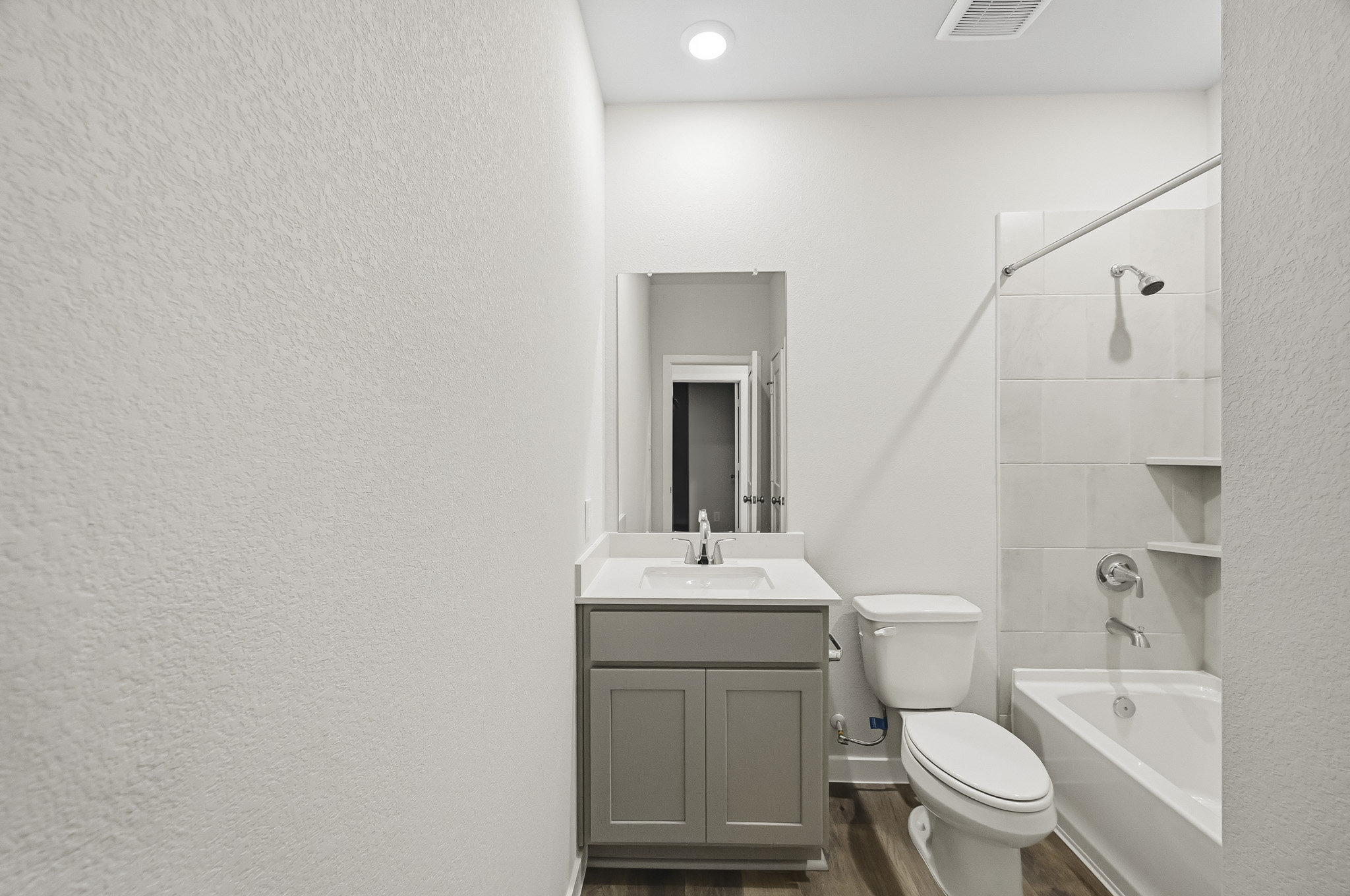A bathroom with a toilet and sink.