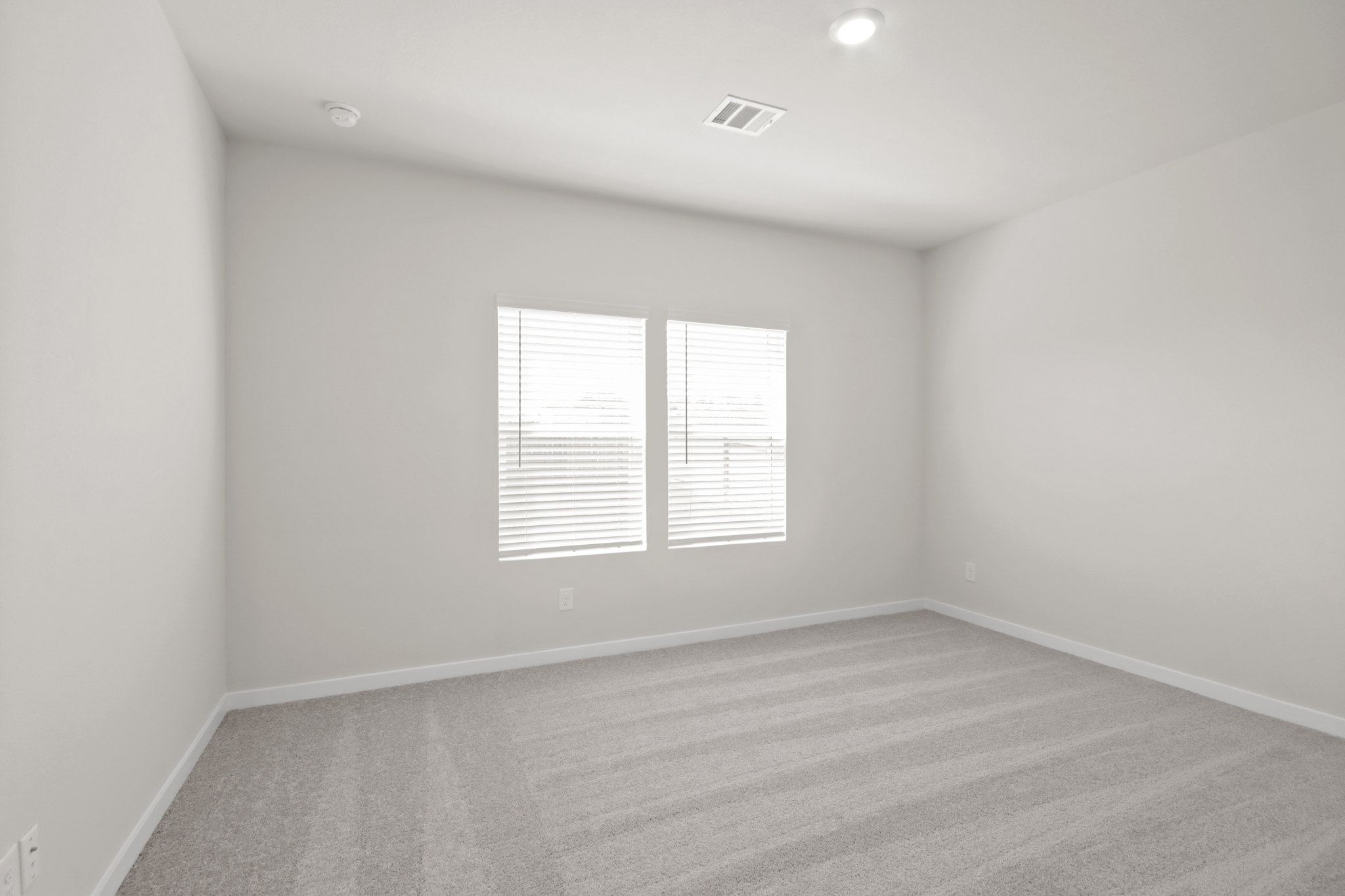 A room with a white wall and a white floor.