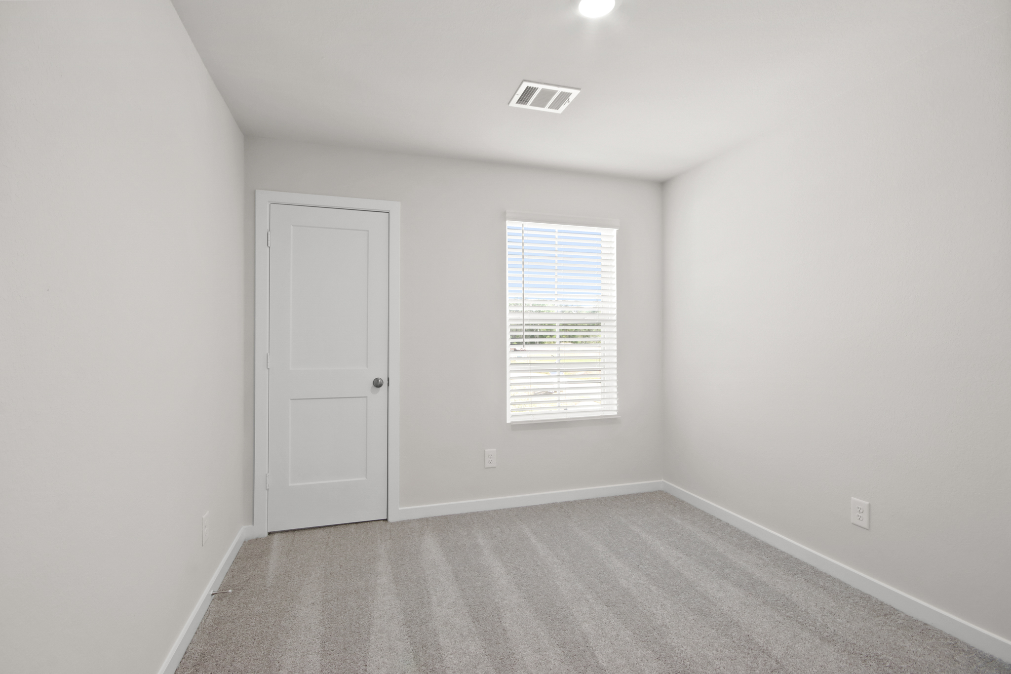 A room with a door and a window.