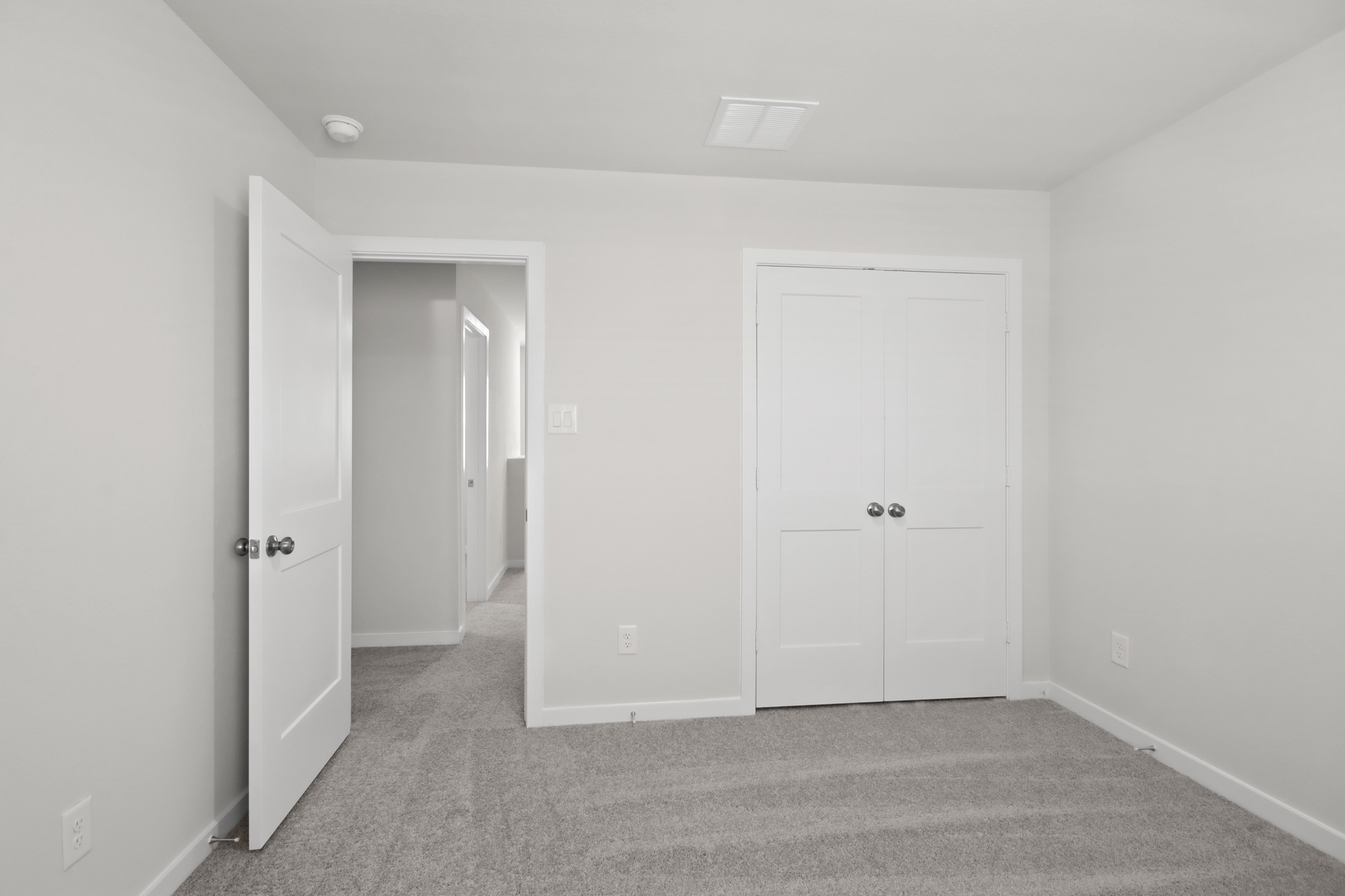 A room with white doors.