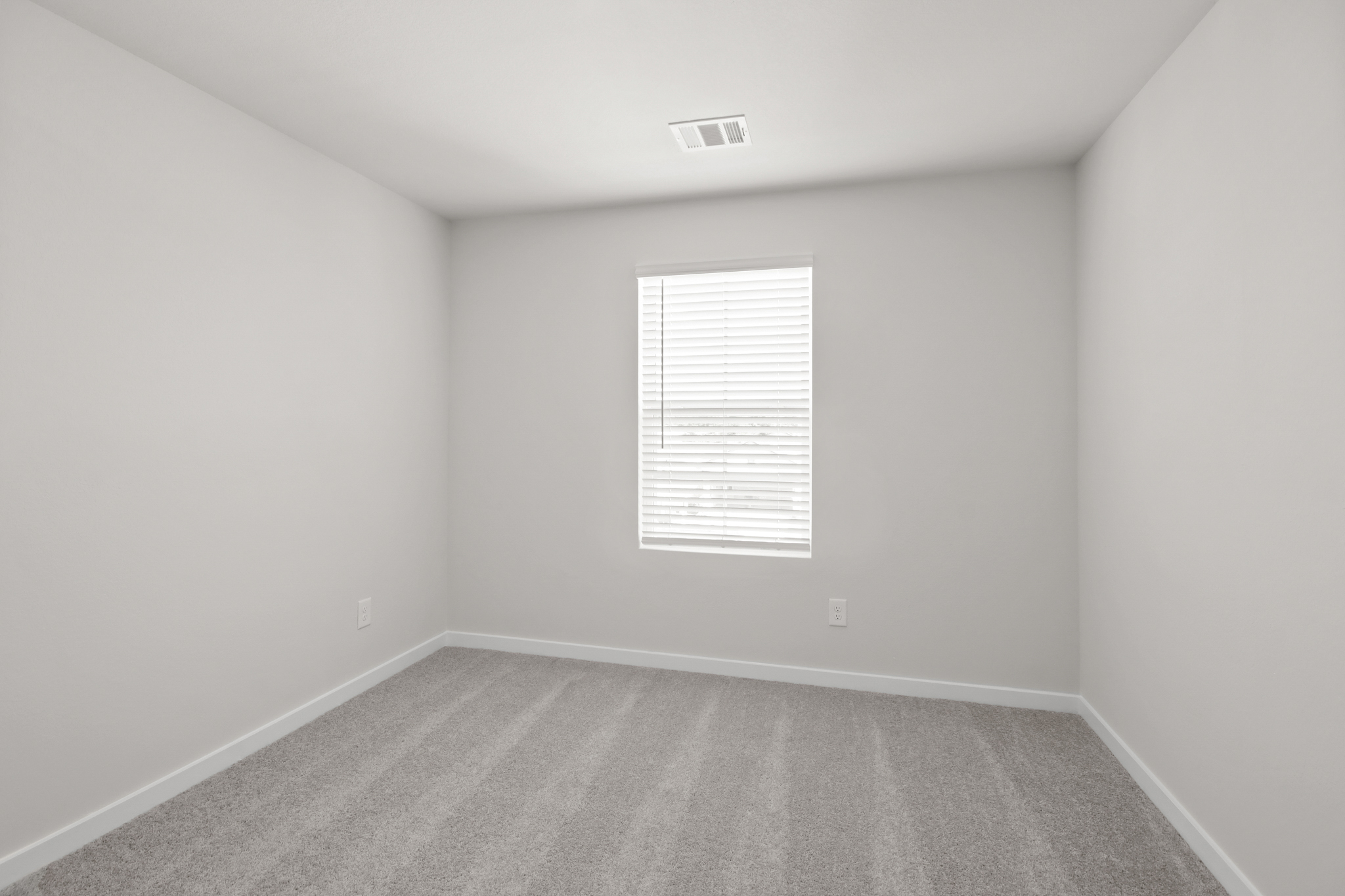 A hallway with a window.