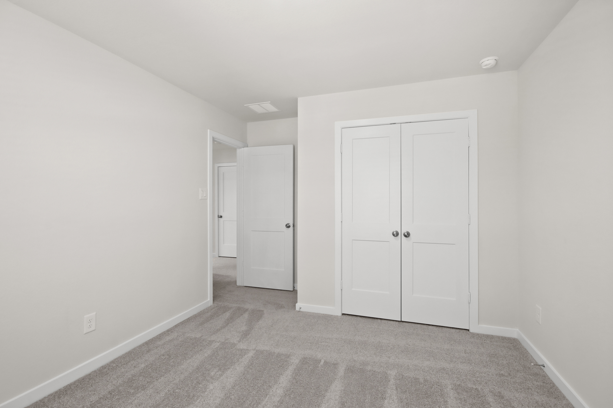 A room with white doors.