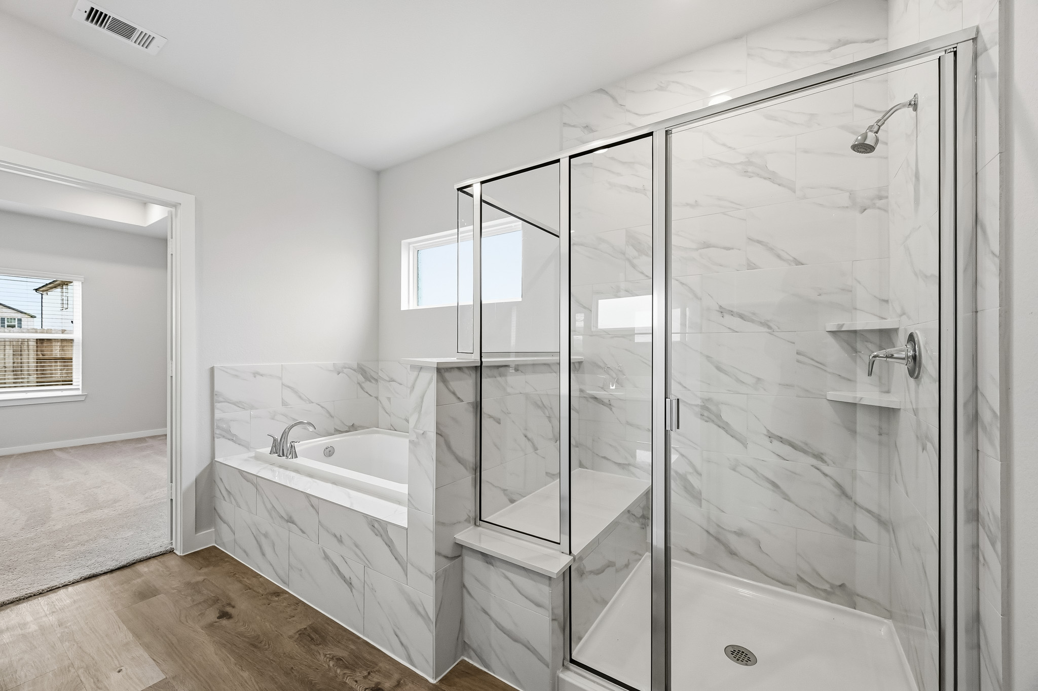 A bathroom with a glass shower.
