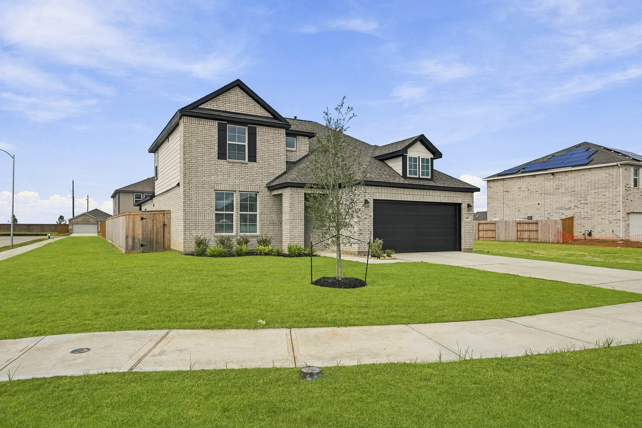 A large house with a driveway.