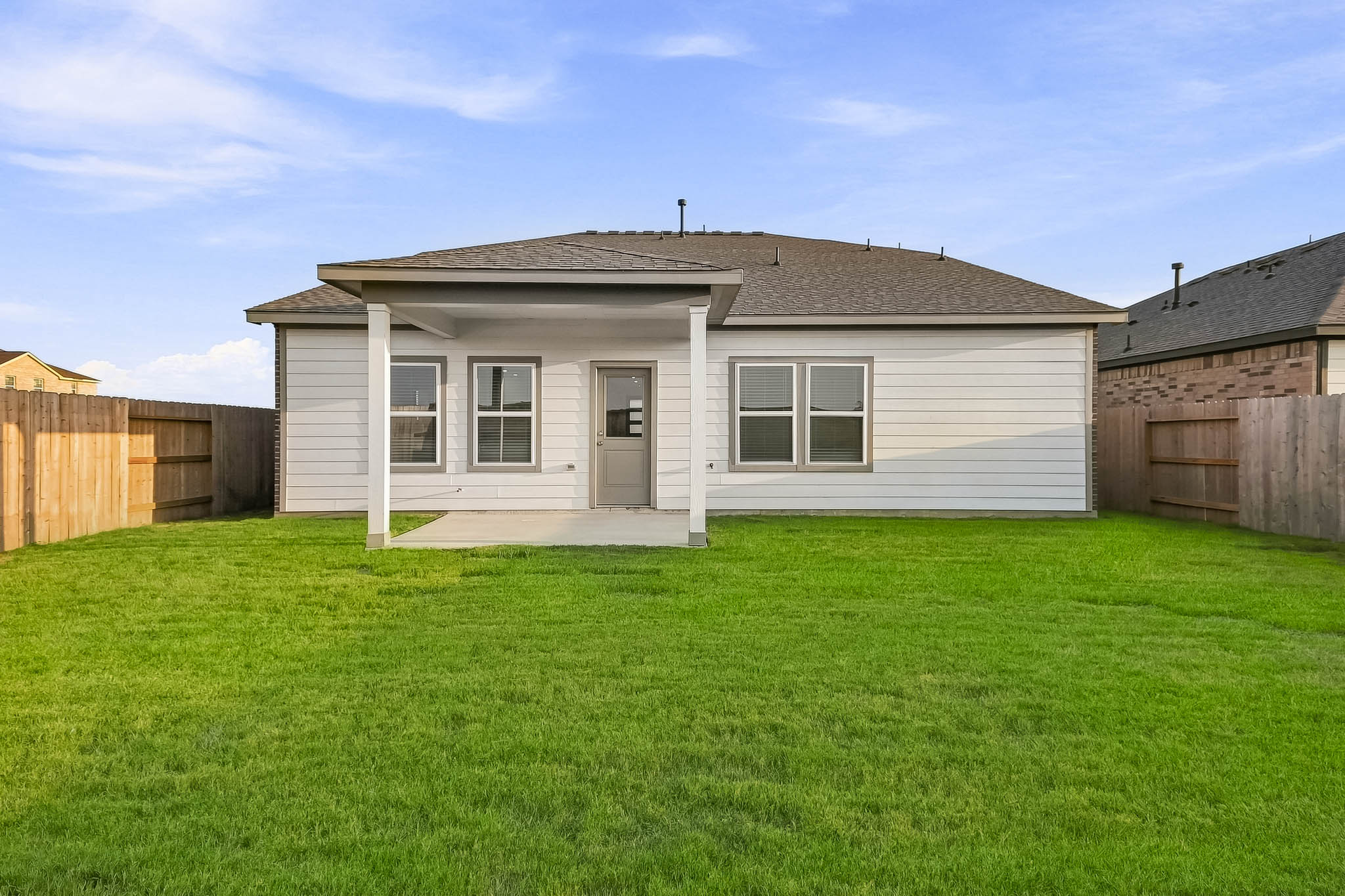 A house with a grass yard.
