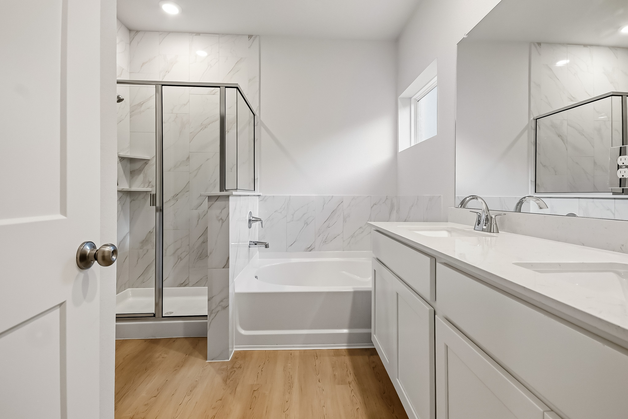 A bathroom with a tub and sink.