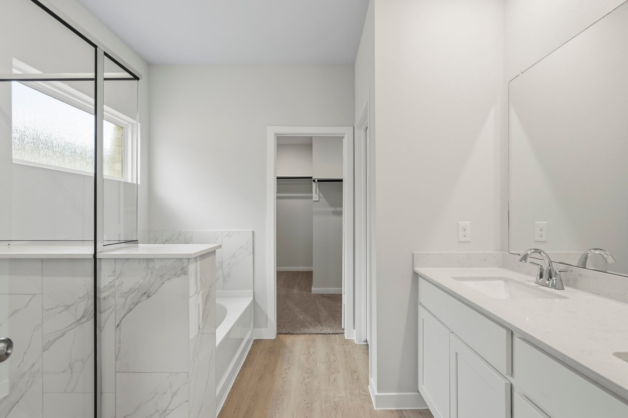 A bathroom with a glass shower.