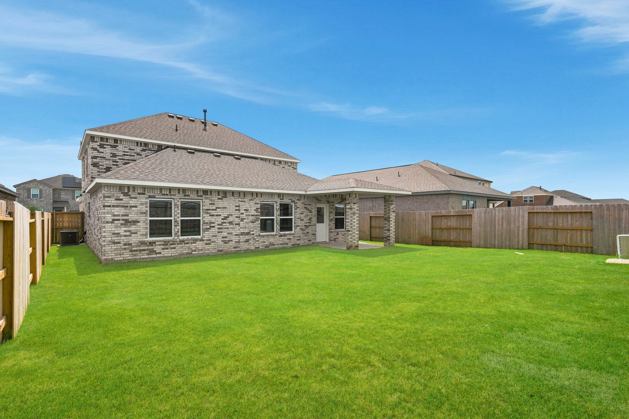 A large house with a fence around it.