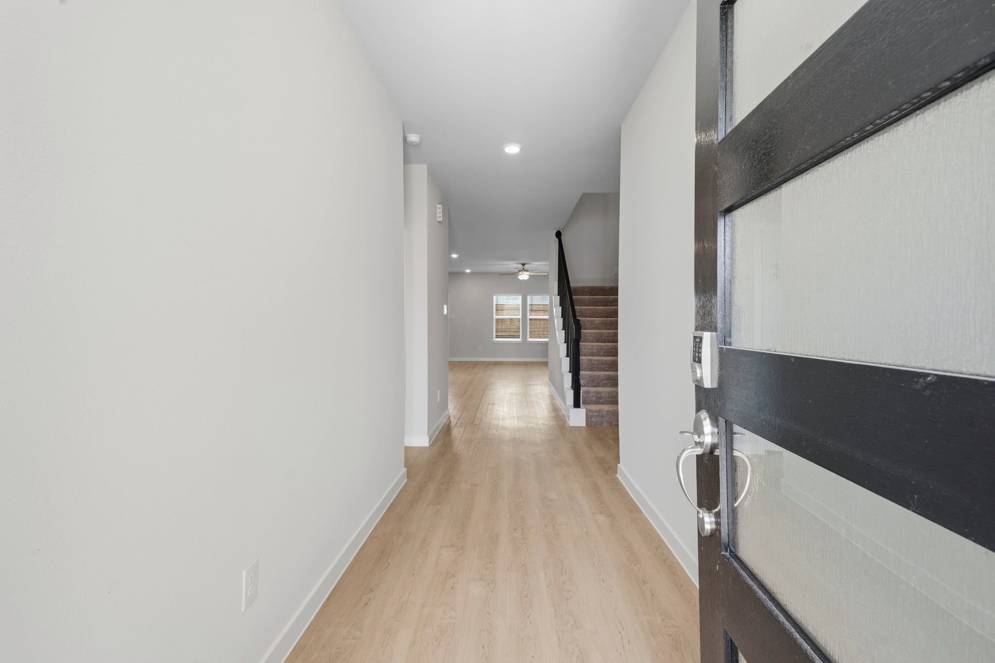 A hallway with white walls.
