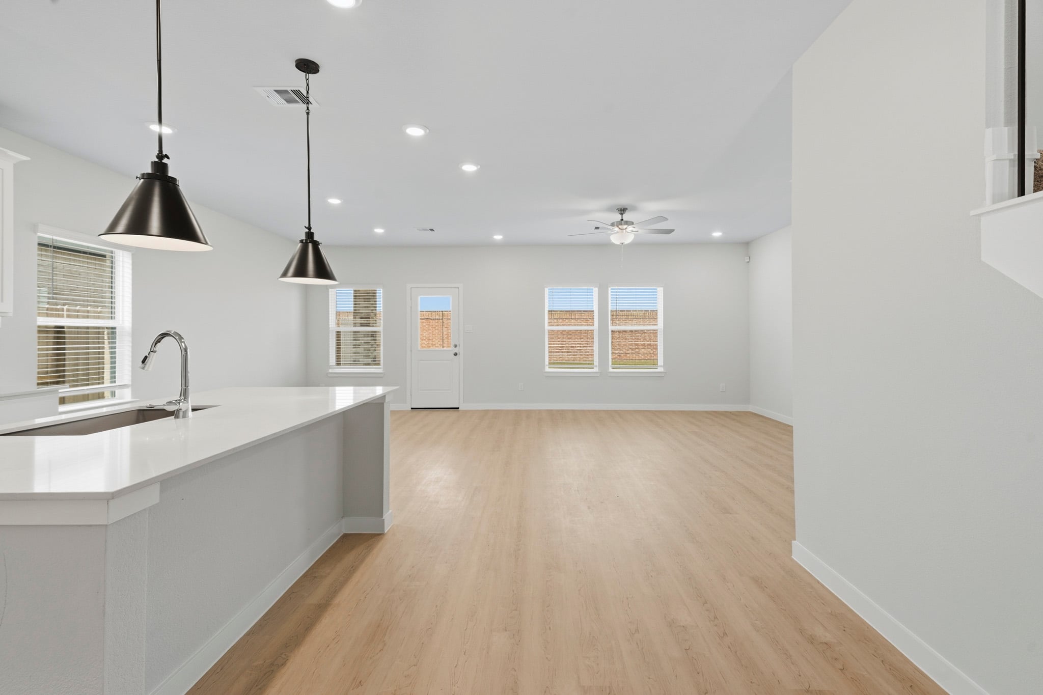 A kitchen with a wood floor.