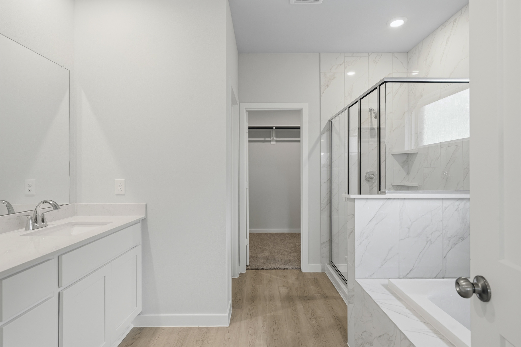 A bathroom with a glass shower.