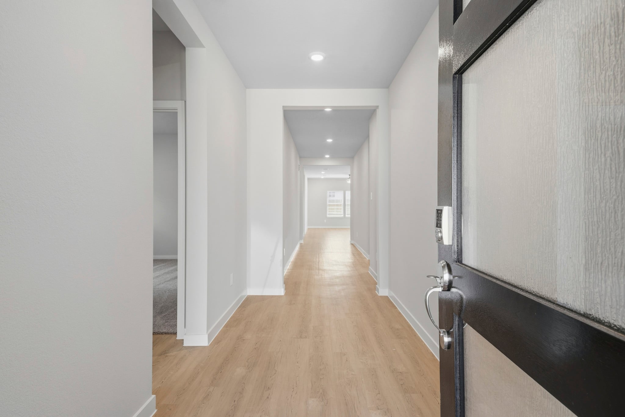 A hallway with white walls.