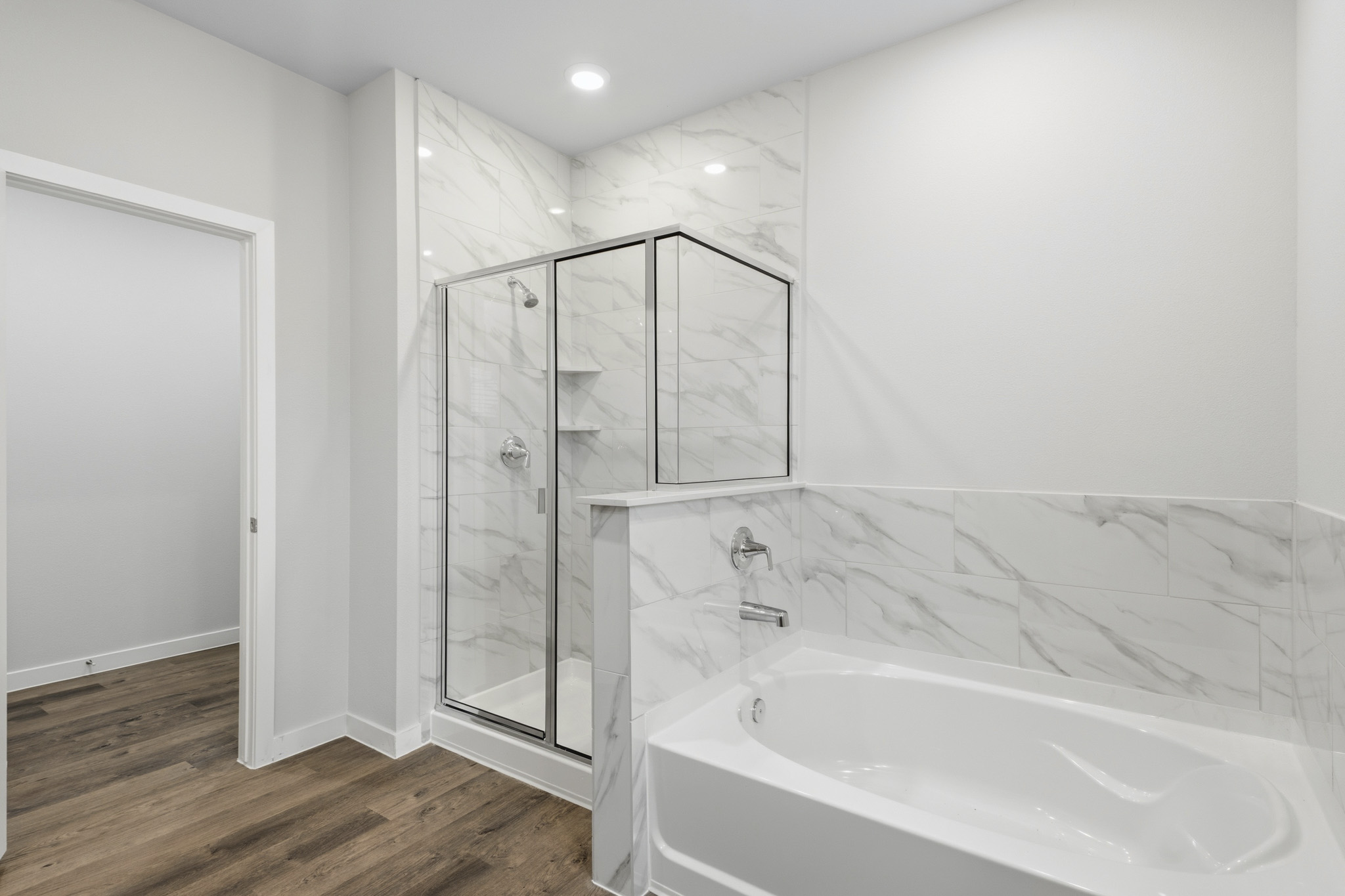 A bathroom with a glass shower.